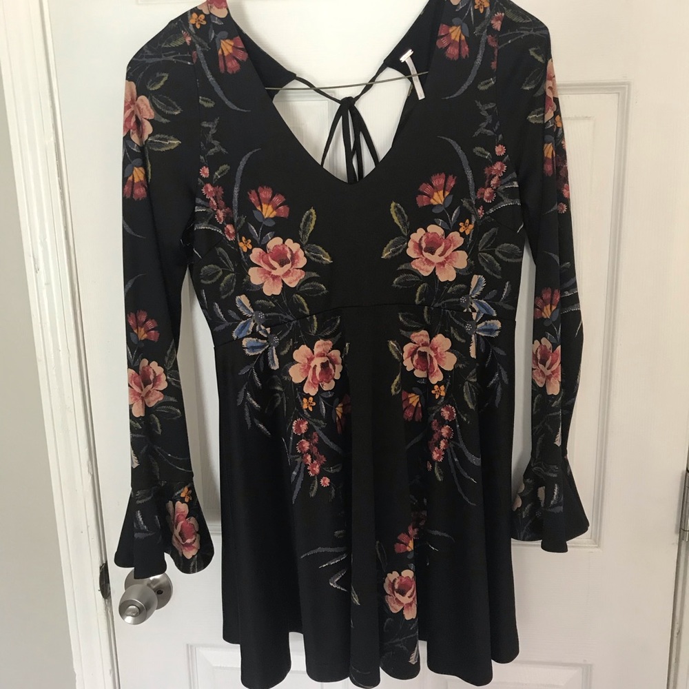 Super cute black skater dress with flute sleeves.